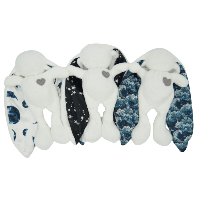 Soft baby cuddle bunny toy in white moons stars waves print newborn comforter and soothing sleep aid